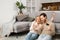 Overjoyed caucasian couple shopping together online. Excited woman and man holding smartphone and credit card, making