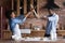 Overjoyed ethnic couple have fun cooking in kitchen