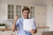 Overjoyed euphoric man reading good news in letter, celebrating success