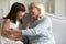 Overjoyed little girl playing with grandmother at home