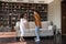 Overjoyed little preteen girl dancing with African American mother.