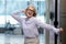 Overjoyed middle-aged businesswoman have fun celebrating work success