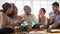 Overjoyed multiethnic millennial friends eating pizza at home