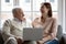 Overjoyed old 70s retired father watching funny movie with daughter.