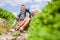 Overjoyed pleasant man with disability tying his shoelaces