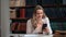 Overjoyed professor student teacher business woman received good news smartphone message at library
