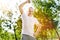 Overjoyed retired man doing sport exercises in the park