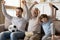 Overjoyed three generations male family celebrating championship win.