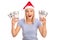 Overjoyed woman with Santa hat holding money