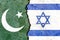 Overlay of the Pakistani and Israel flags on a weathered cracked wall background.