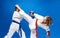 With overlays on the hands of the athletes are training blows karate