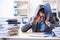 The overloaded with work employee under paperwork burden