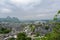 Overlook to ancient town in mountains on cloudy spring day