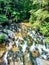 Overlook view of the bottom of the waterfall on a warm summer day