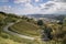 Overlooking the mountains, winding roads, vineyards and resident