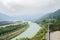 Overlooking river from mountainside fenced viewing platform in c