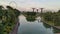 Overlooking shot of Ferris Wheel and Supertrees Gardens By the Bay