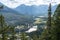 Overlooking the Town of Banff from Tunnel Mountain Trail summit in summer sunny day. Banff National Park