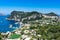 Overlooking view of Capri Island with Marina Grande harbor and Punta del Capo