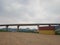 An overpass that connects one island to a mountainous area for nickel mine transport transportation trips