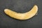 overripe unskin banana on dark background