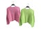 Oversize knit sweaters on hangers. Trendy clothes collage