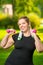 oversize woman in headphones with dumbbells in hand playing sports