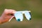 Oversized sunglasses hold by hand closeup. Selective focus