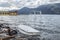 Overturned boat and submerged swing from Lake Maggiore in flood in Germignaga