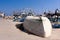 An overturned fishing boat, on the edge of the dock, in Cabo de Palos, Murcia, Spain