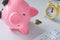 Overturned piggy bank and a few small coins, The concept of low interest rates on bank deposits