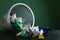 Overturned recycle bin with crumpled papers on table against color background