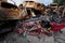 Overturned red destroyed car in war torn Ukrainian city