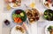 Overvew photo of healthy family dinner with baked potato and chiken and salad