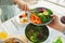 Overvew photo of healthy family dinner with baked potato and chiken and salad