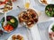 Overvew photo of healthy family dinner with baked potato and chiken and salad