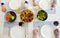 Overvew photo of healthy family dinner with baked potato and chiken and salad