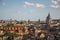 Overview cathedrals domes and roofs of buildings in the sunset of Rome.