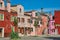 Overview of colorful terraced houses on sunny day in Burano.