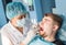 Overview of dental caries prevention. man at the dentist`s chair during a dental procedure. Healthy Smile