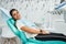 Overview of dental caries prevention.Woman at the dentist`s chair during a dental procedure. Beautiful Woman smile close