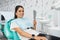 Overview of dental caries prevention.Woman at the dentist`s chair during a dental procedure. Beautiful Woman smile close
