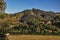 Overview of hills with woods and house in the sunrise, near Monte Alegre do Sul.