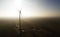 Overview of a lonely windturbine in green meadow Poland