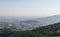 Overview of the polluted city of Barcelona, from the Collserola mountain, with a layer of smog over it