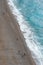 Overview of Positano coast. Soft waves on sandy beach