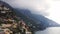 Overview of Positano village near Amalfi Coast, Italy on a cloudy and foggy day.