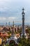 Overview of the Right Pavilion with a Pinnacle, crowned with a Gaudi-typical five-beam cross of the Park Guell in Barcelona, Spain