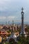 Overview of the Right Pavilion with a Pinnacle, crowned with a Gaudi-typical five-beam cross of the Park Guell in Barcelona, Spain