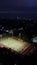 An overview of tennis court under night sky